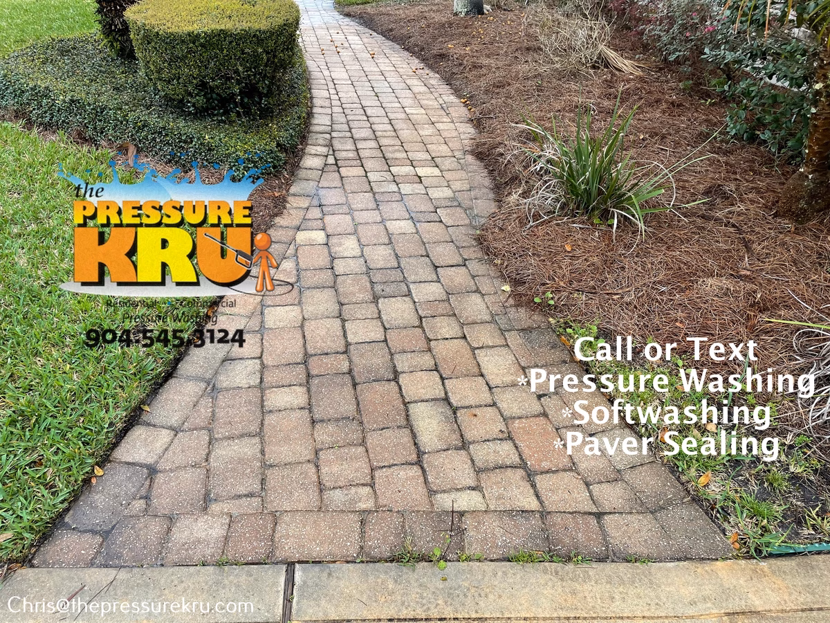 Low-pressure washing technique paver driveway before pressure washing in Julington Creek Plantation.