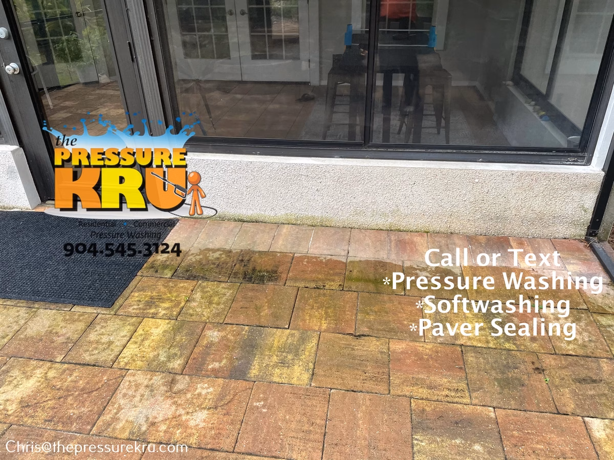 Residential patio pressure washing before soft washing in Julington Creek Plantation.