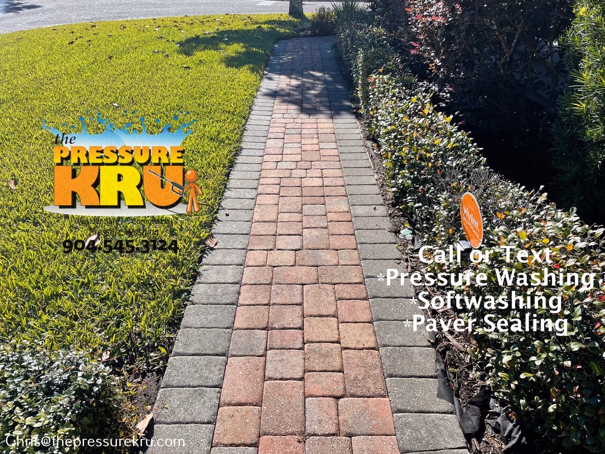 Professional pressure washing paver driveway after in Greenland Chase.