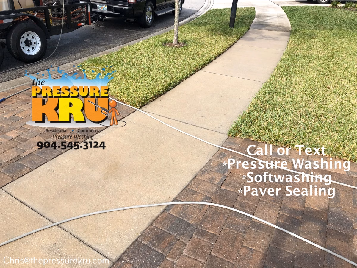 Beautiful clean paver driveway after pressure washing in Bartram Springs.