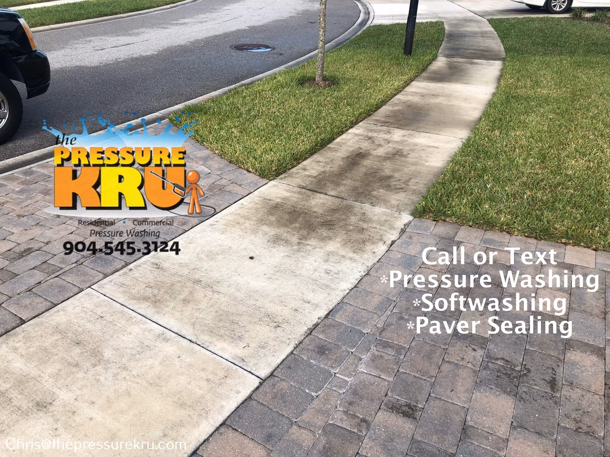 Beautiful clean paver driveway before pressure washing in Bartram Springs.