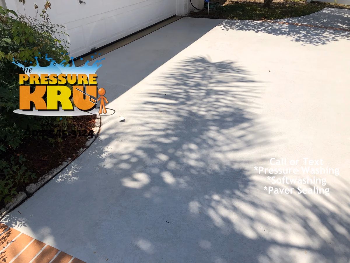 Pressure cleaning combined with soft washing painted concrete driveway in Sandy Creek after