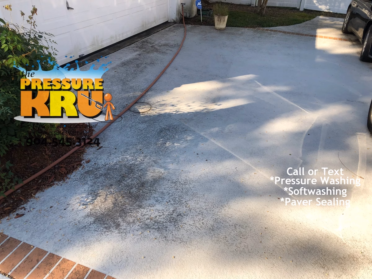 Pressure cleaning combined with soft washing painted concrete driveway in Sandy Creek before