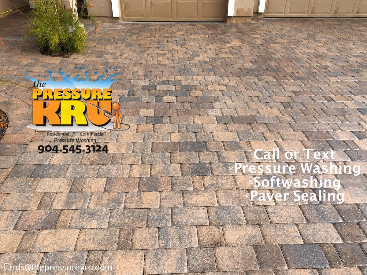 Bright clean paver driveway after pressure washing in Silverleaf Village.