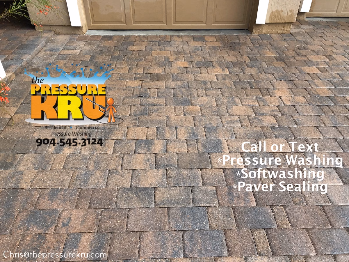 Oil Stained paver driveway after pressure washing in Mill Creek Forest,