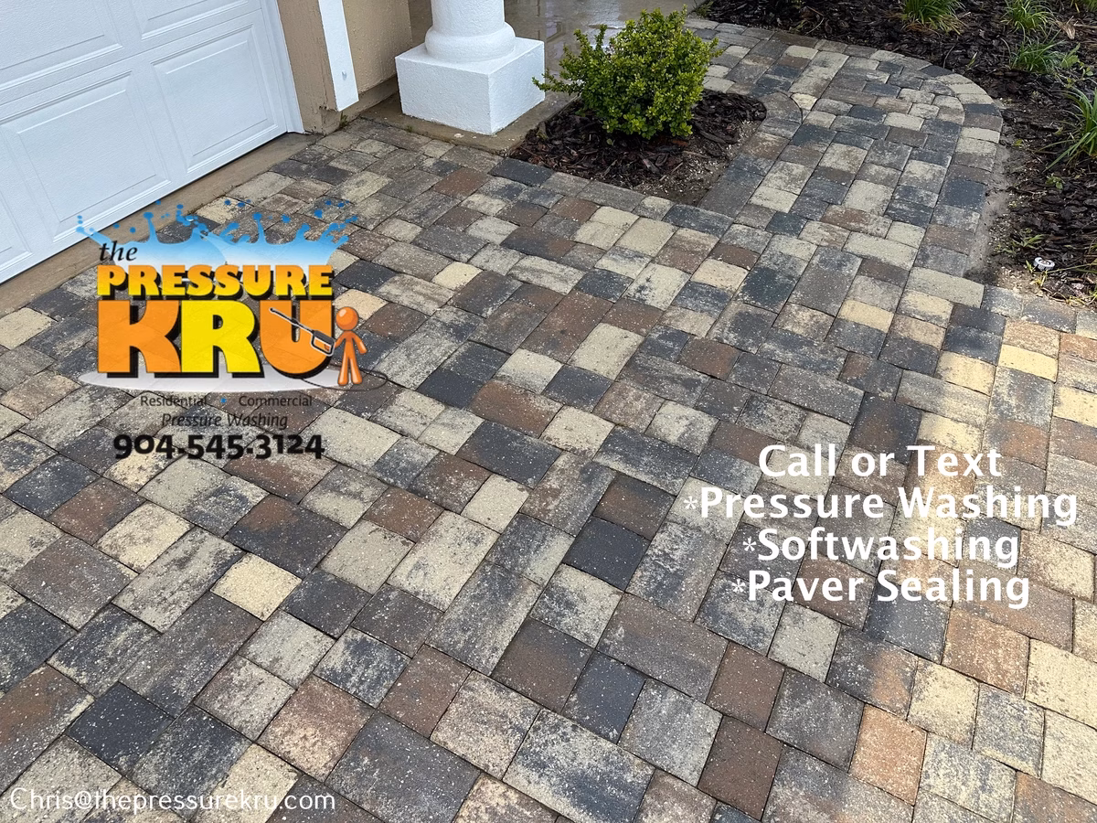 Clean restored paver driveway after professional pressure washing in Fruit Cove, FL.