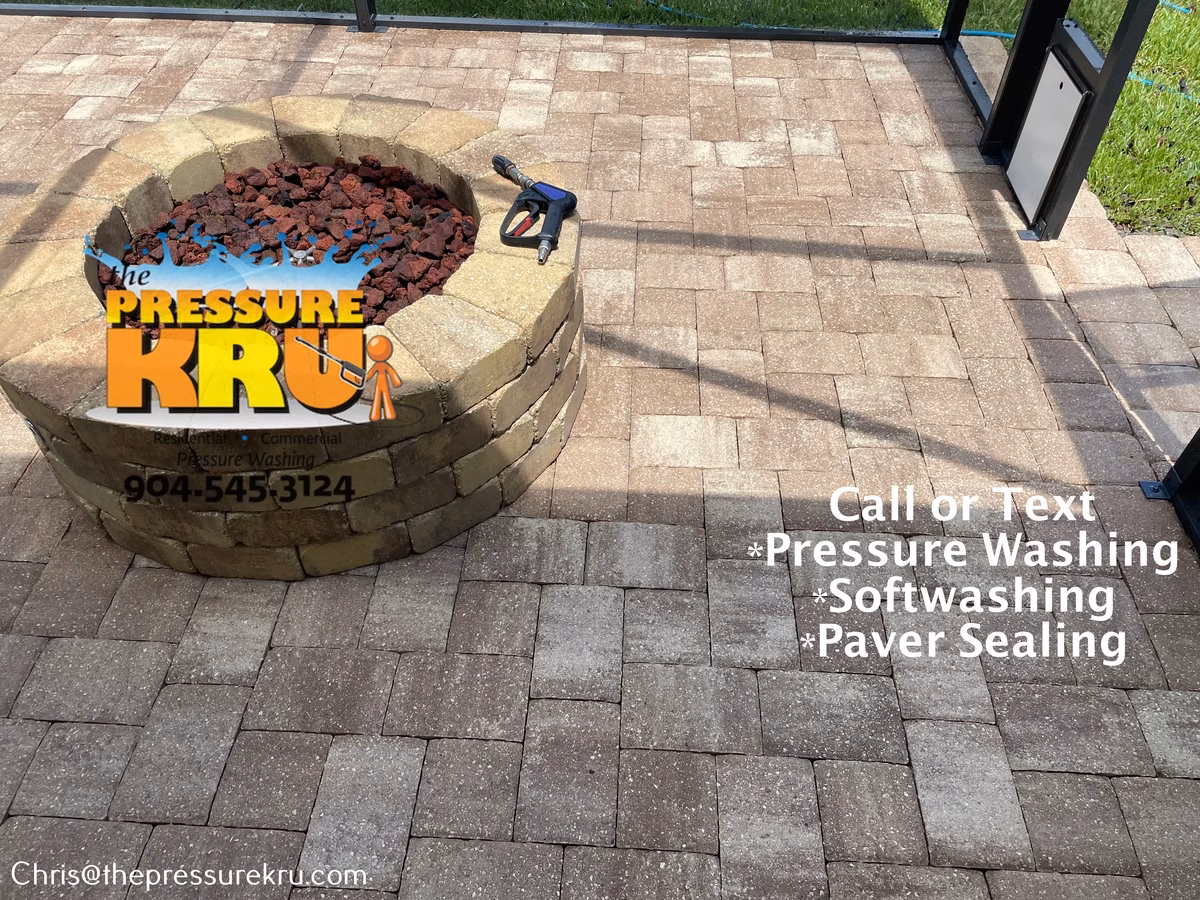 Removing black algae and weeds from paver patio in Julington Lakes after