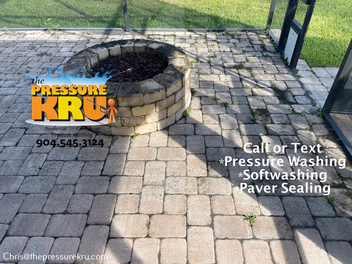Removing black algae and weeds from paver patio in Julington Lakes before