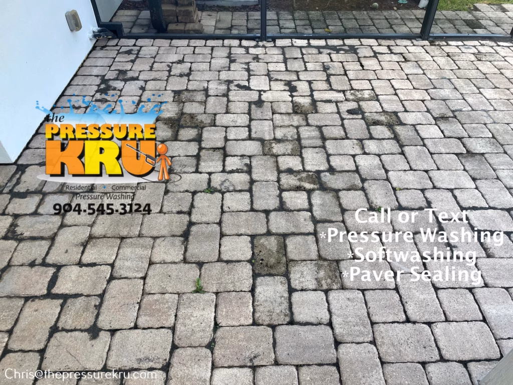 Pressure washing restored color to a paver patio in Julington Creek Plantation before.
