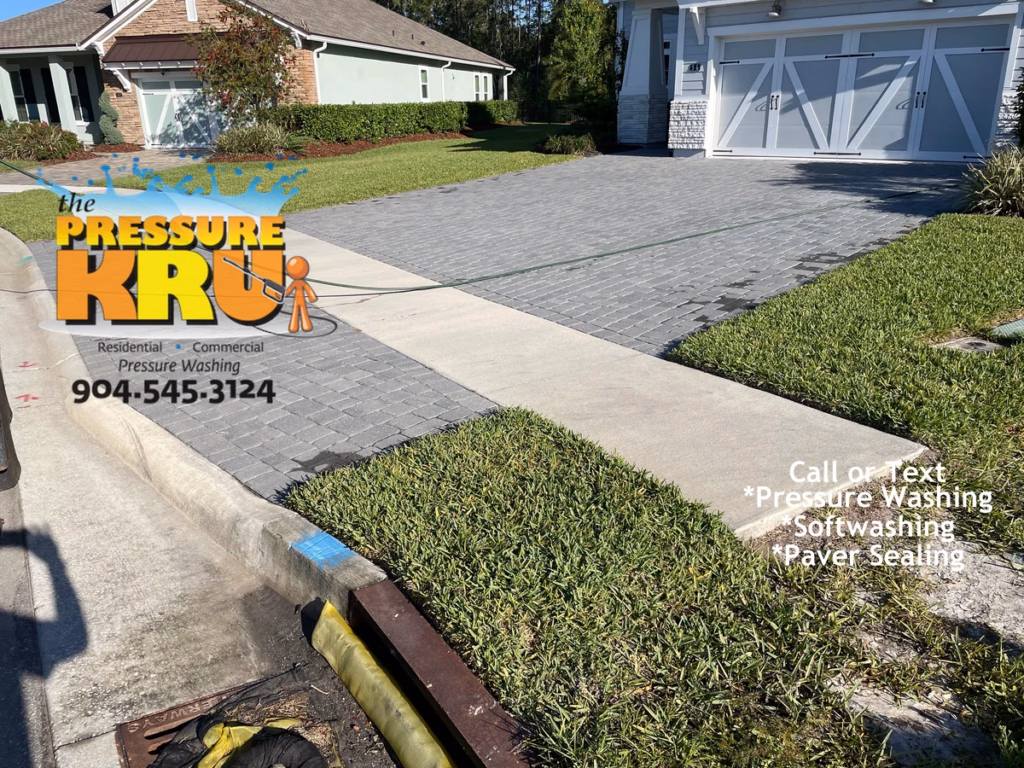 Paver sealing driveway preserving color and enhancing joint stabilization. Home near St. Johns, FL