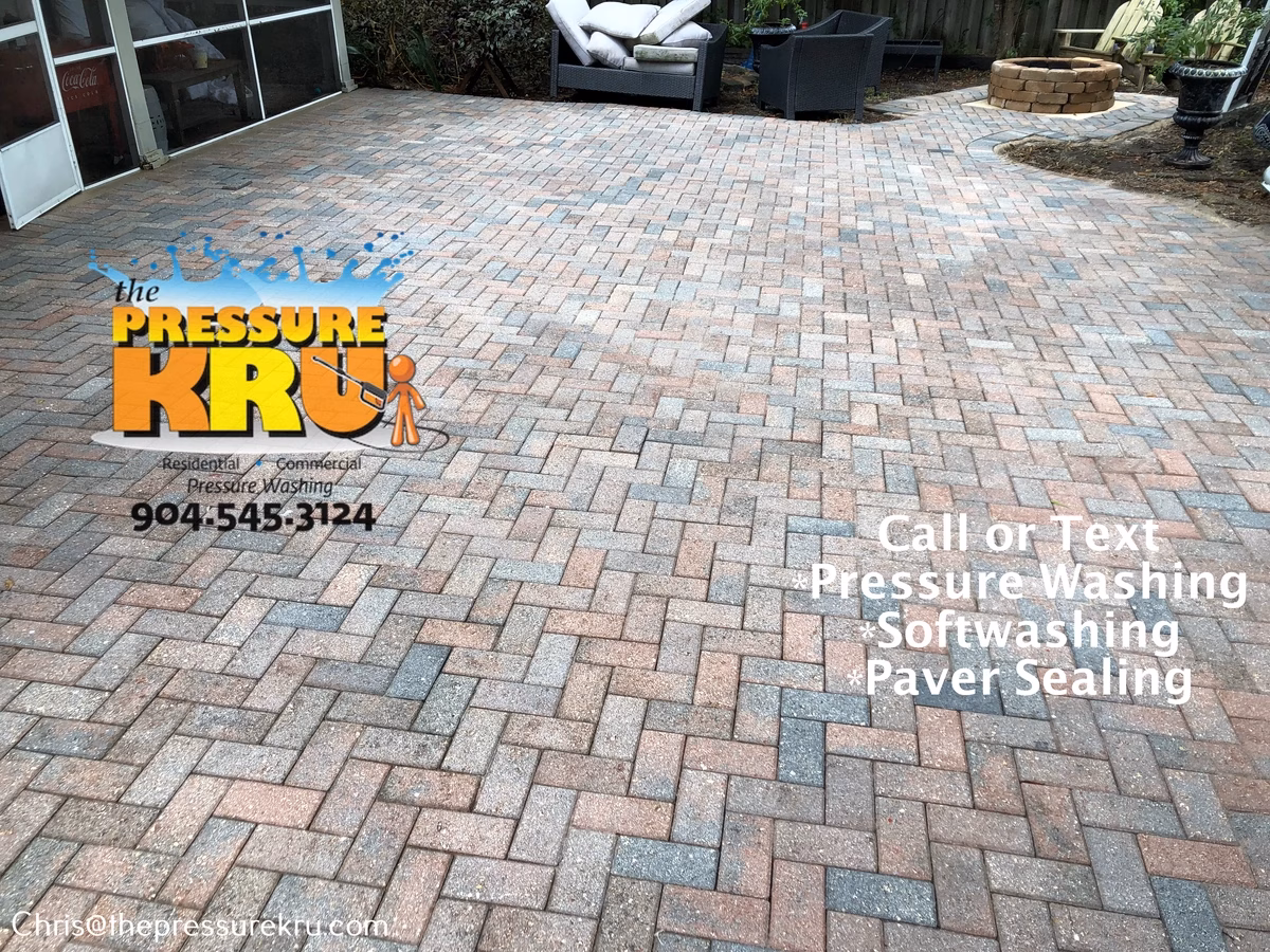 Pressure washing back yard paver patio in St. Johns Forest after.