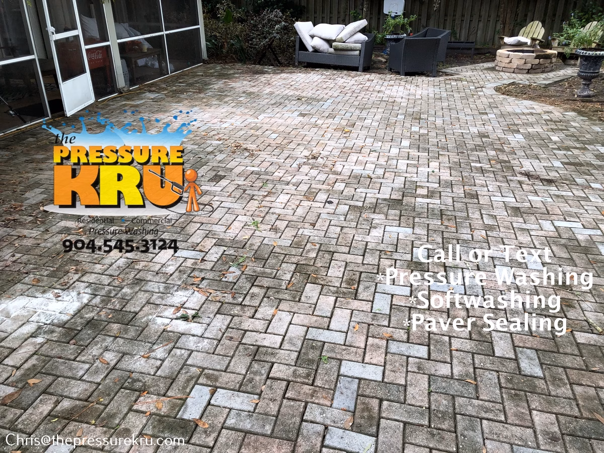 Pressure washing back yard paver patio in St. Johns Forest before.