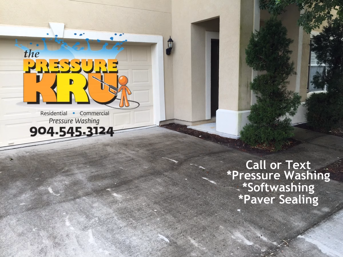 Home driveway cleaned to improve curb appeal in St. Johns, FL. Before picture.