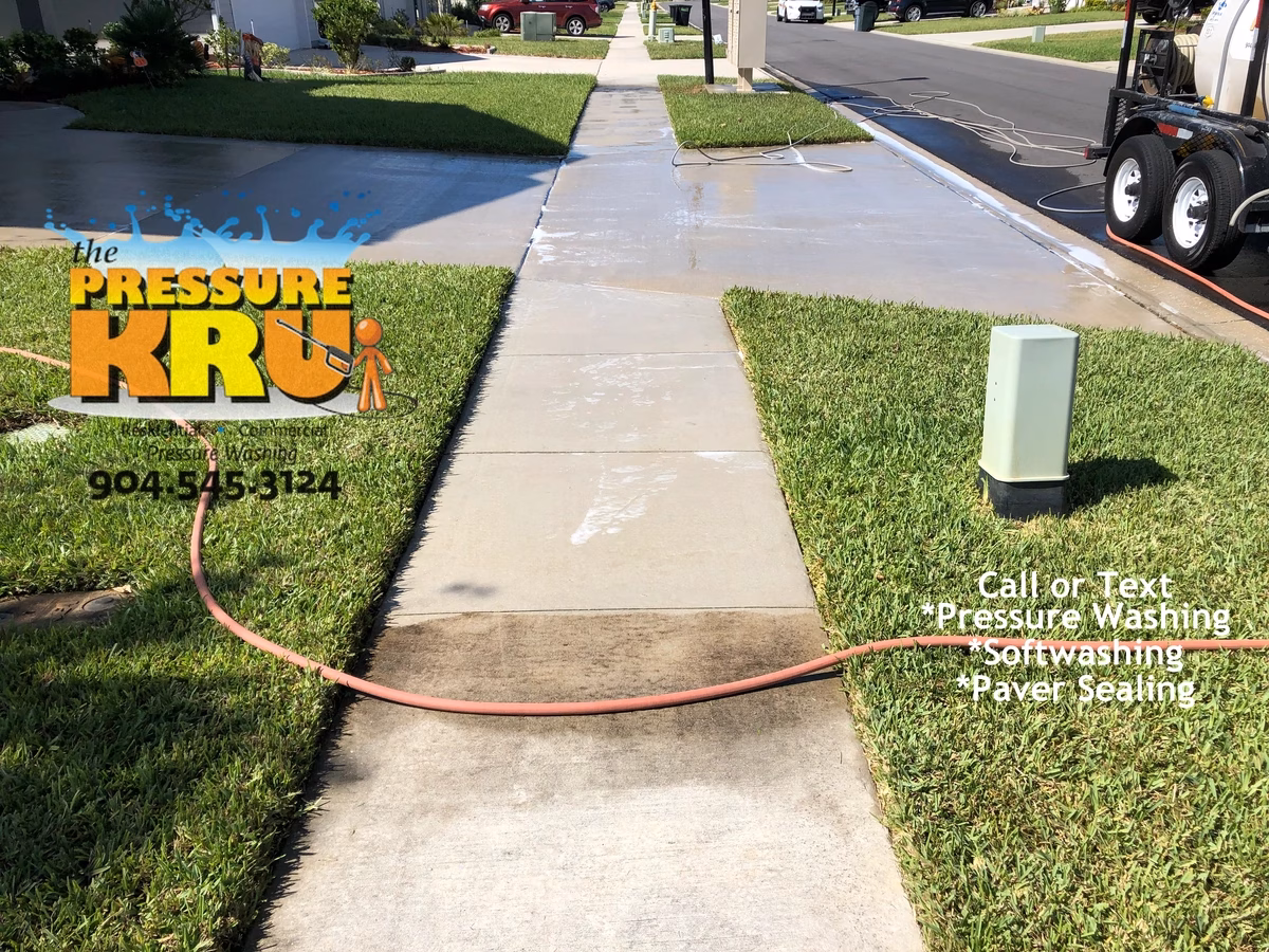 Bright concrete driveway after professional surface cleaning in St. Johns, FL.