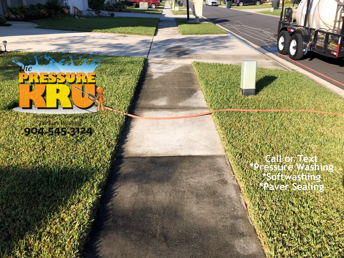 Bright concrete driveway before professional surface cleaning in St. Johns, FL.