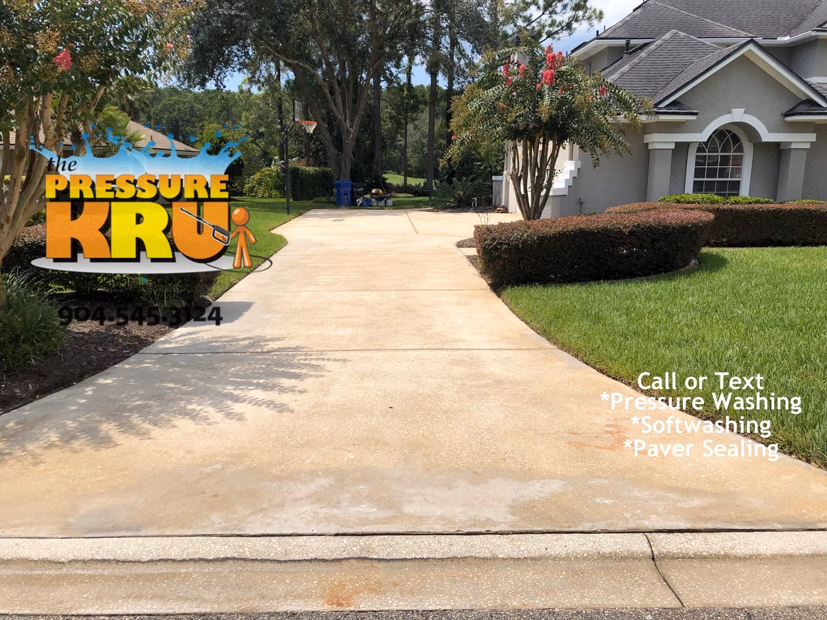 Driveway cleaning results after professional pressure washing in St. Johns, FL.