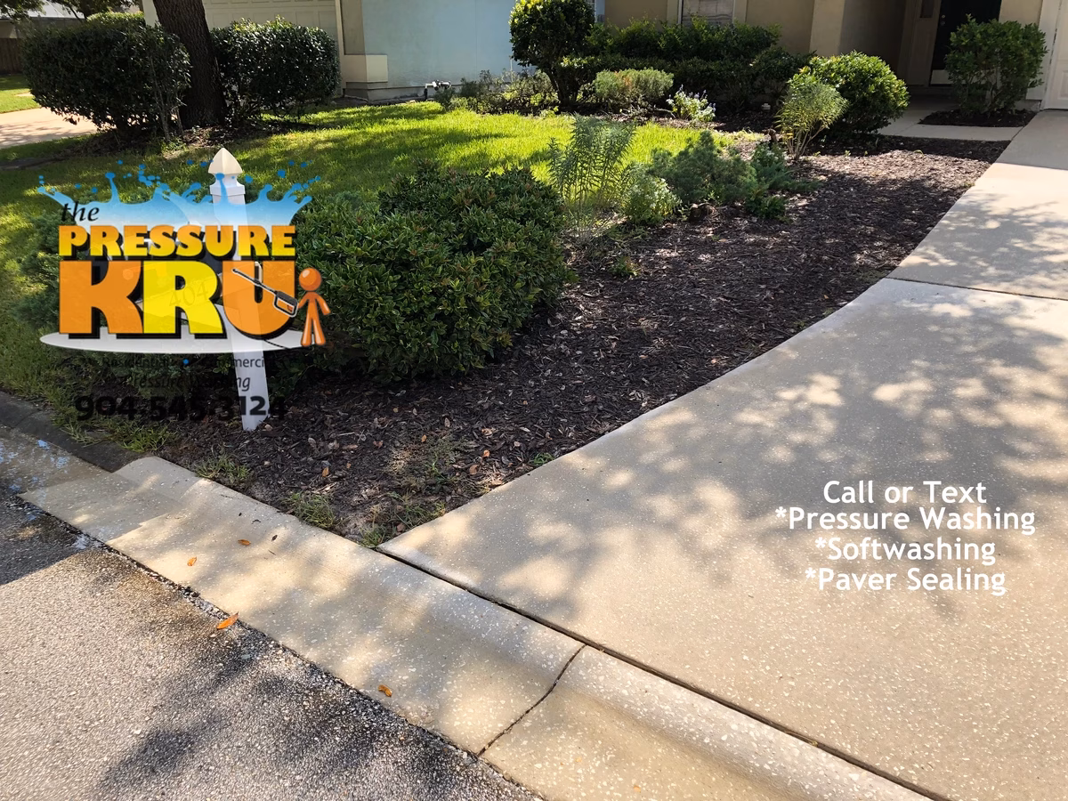 After pressure washing stained concrete driveway and curbs in Jacksonville, FL.