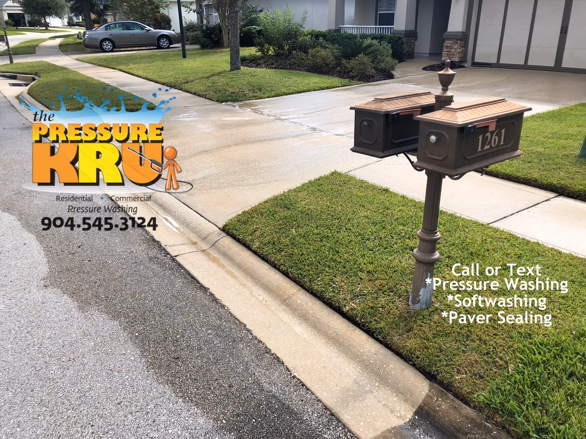 Freshly cleaned driveway at a home in St. Johns, FL. After pressure washing and softwashing.