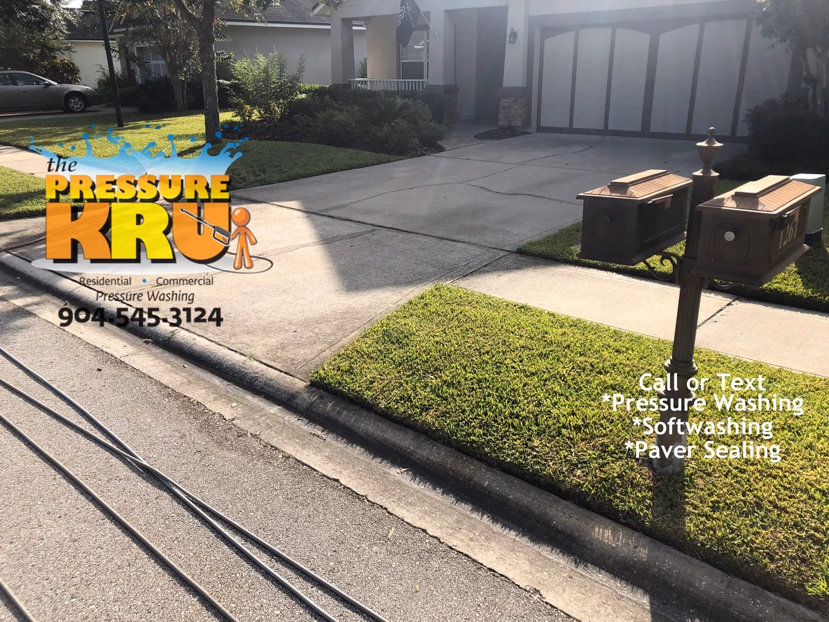 Freshly cleaned driveway at a home in St. Johns, FL. Before pressure washing and softwashing.