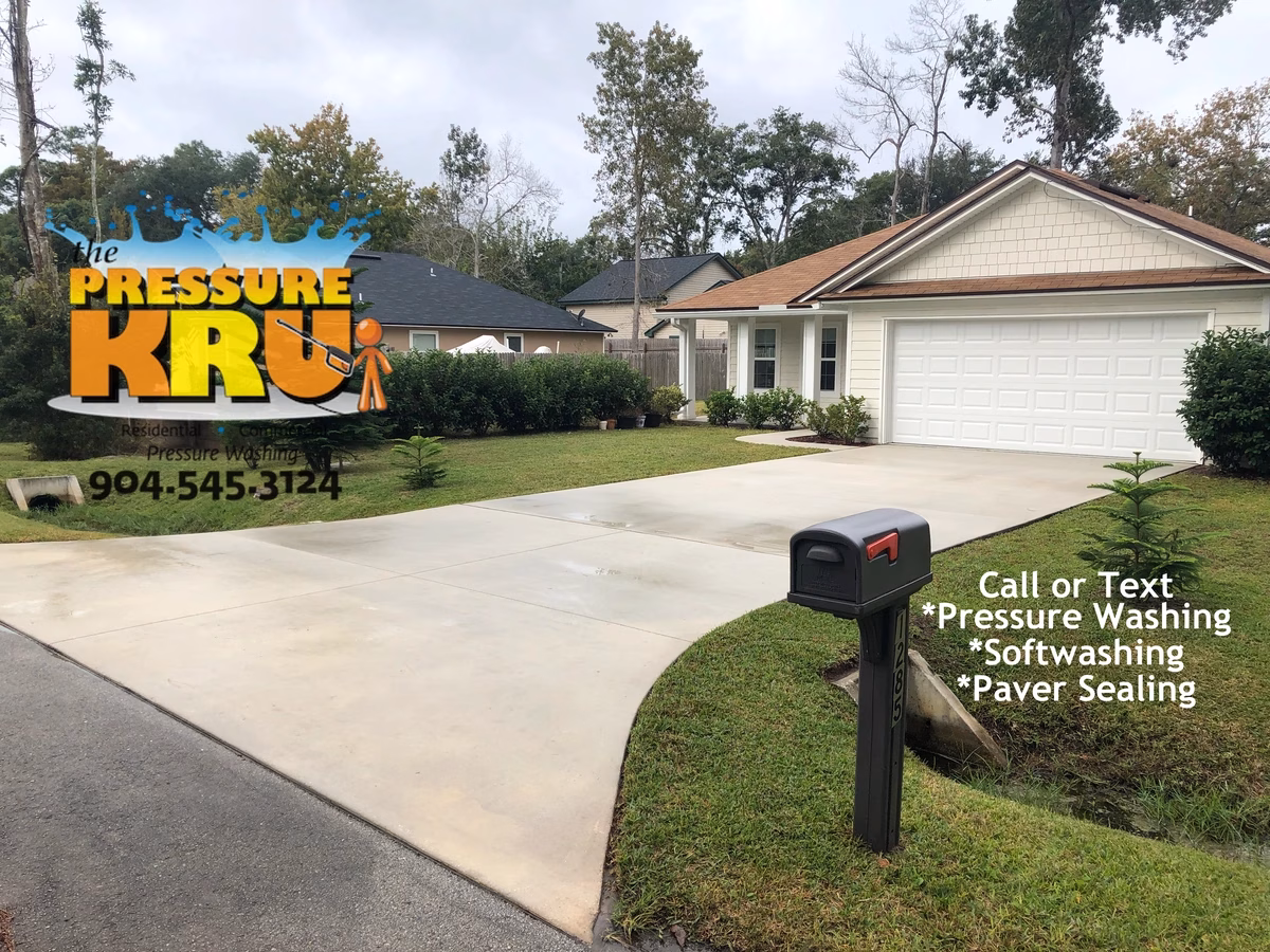 Driveway surface cleaned after soft washing and pressure washing in World Golf Village.