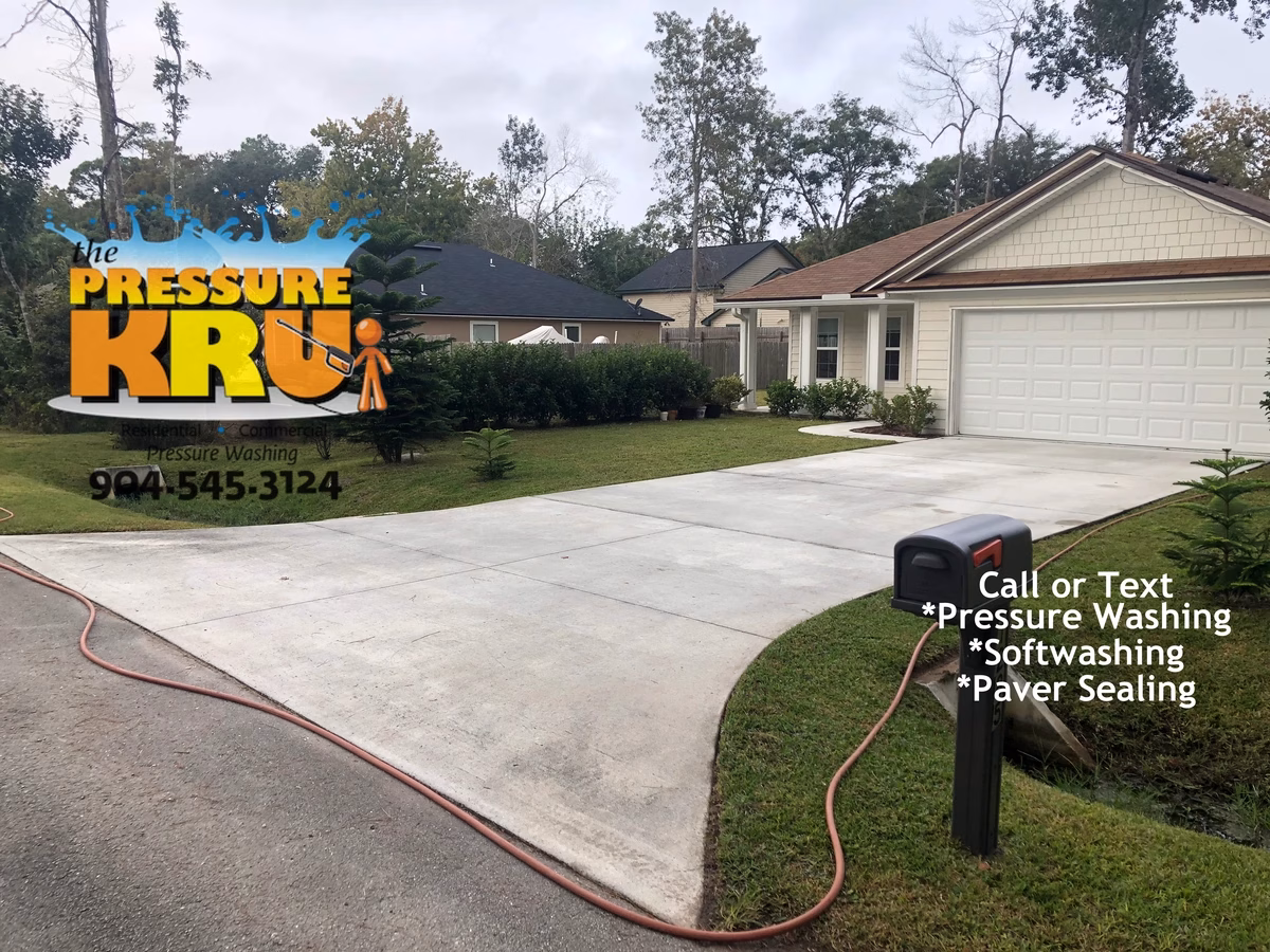 Driveway surface cleaned before soft washing and pressure washing in World Golf Village.