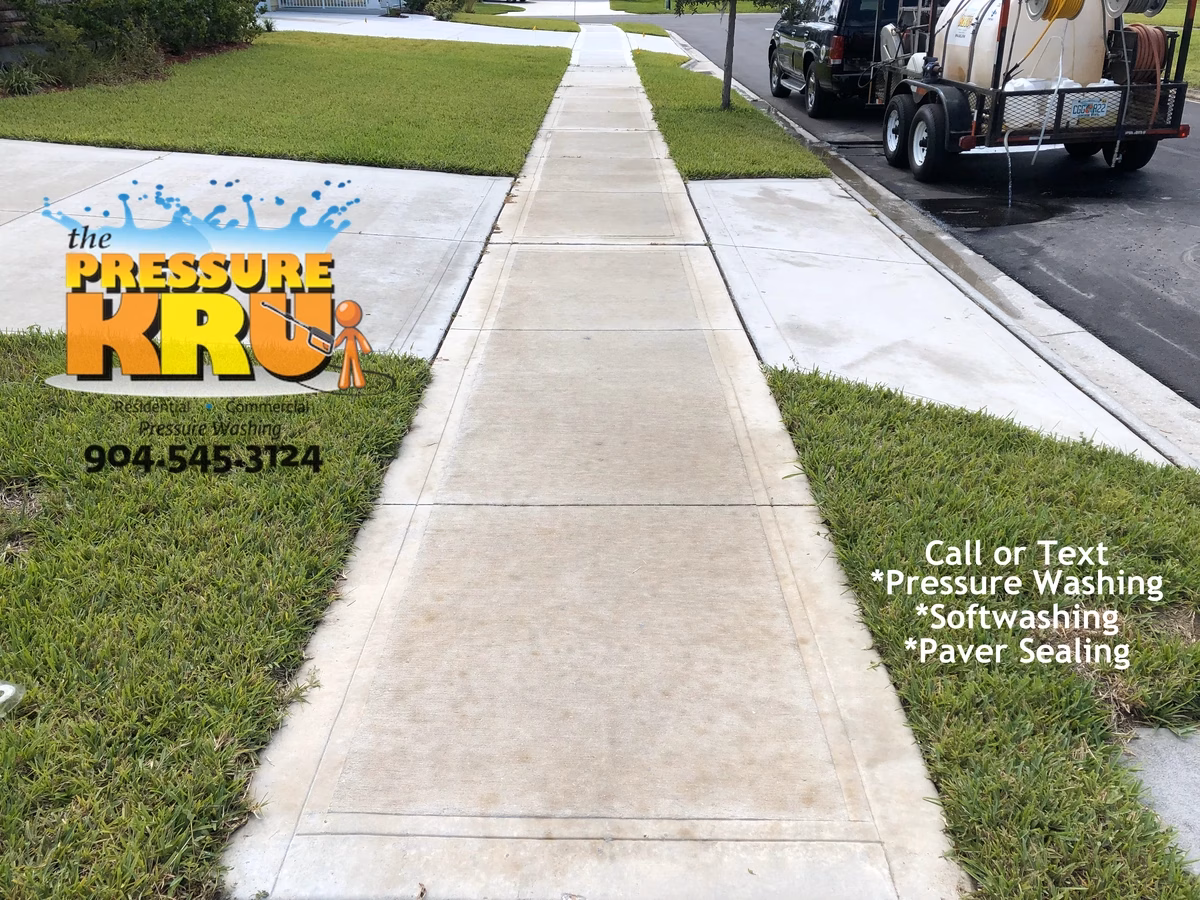 Residential concrete driveway cleaned with professional washing in St. Johns, FL. After image.