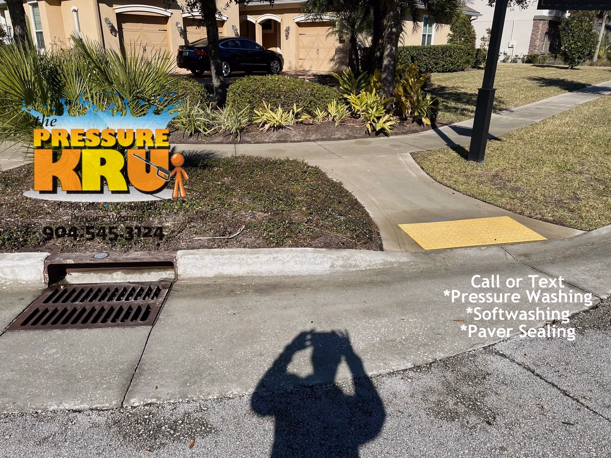 After driveway pressure washing restoring bright concrete in St. Johns, FL.