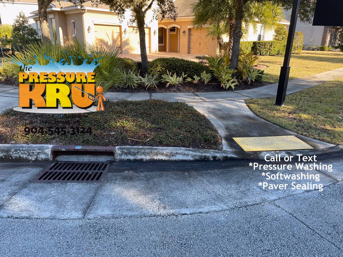 Before driveway pressure washing restoring bright concrete in St. Johns, FL.
