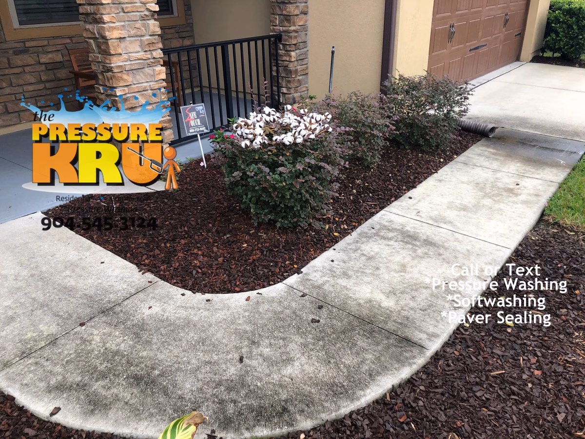 Before driveway pressure washing in St. Johns, FL home.