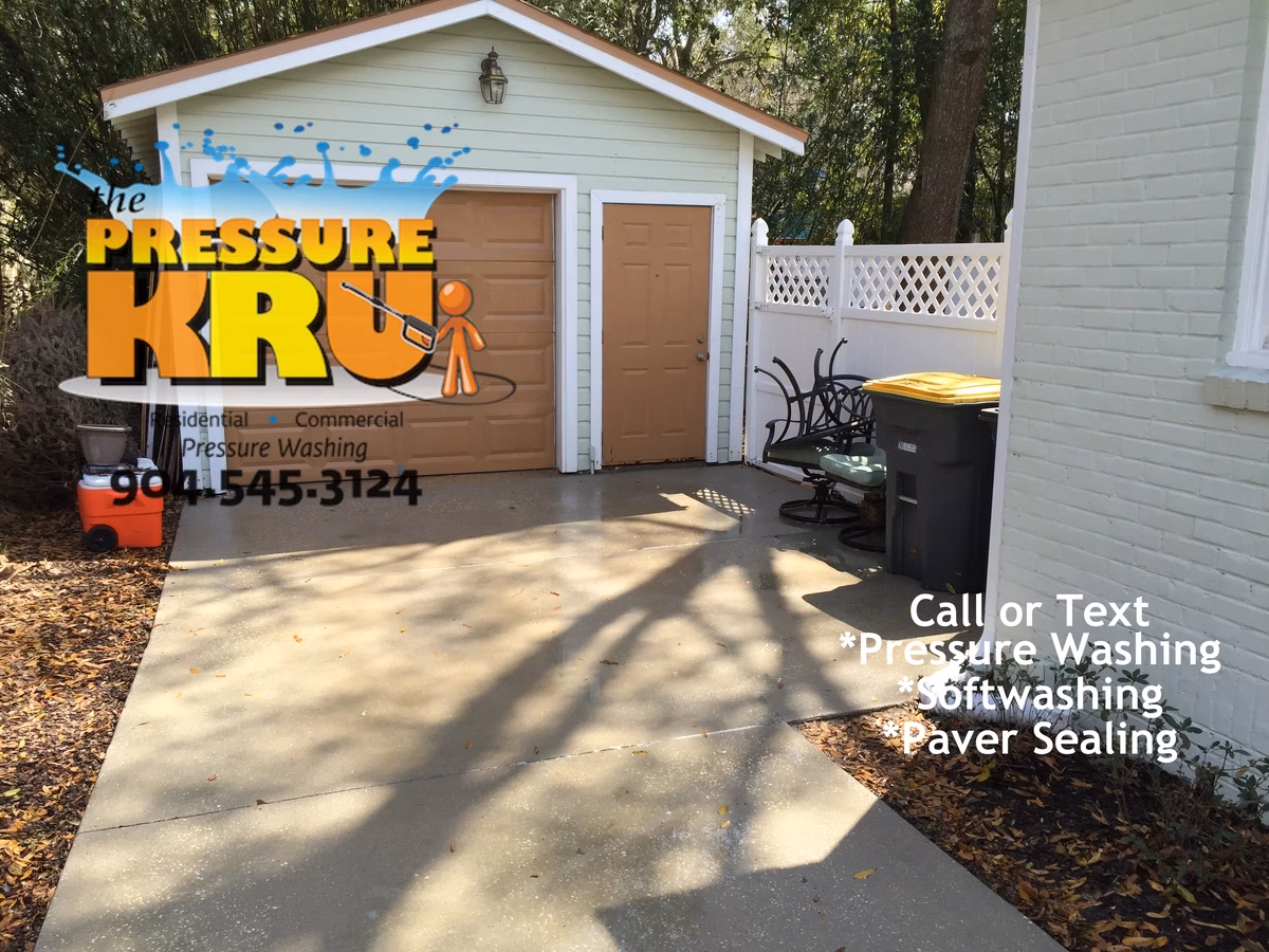 Driveway pressure washing in Jacksonville, FL after chemical post treatment.