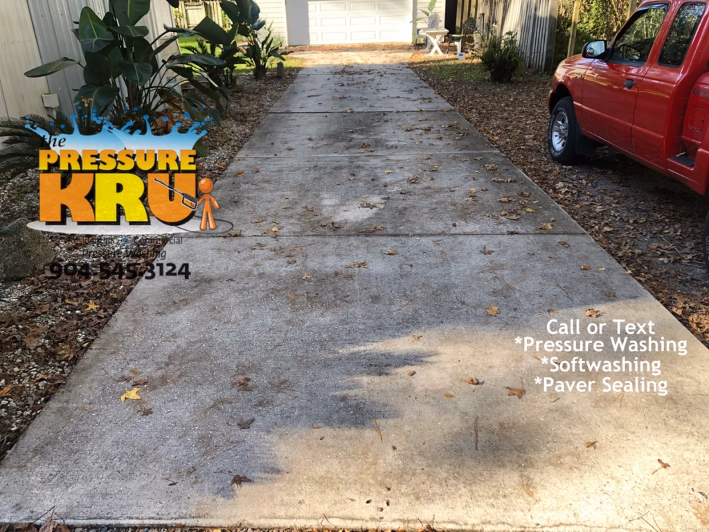 Driveway cleaning service in St. Augustine, FL 32092 before removing years of grime.