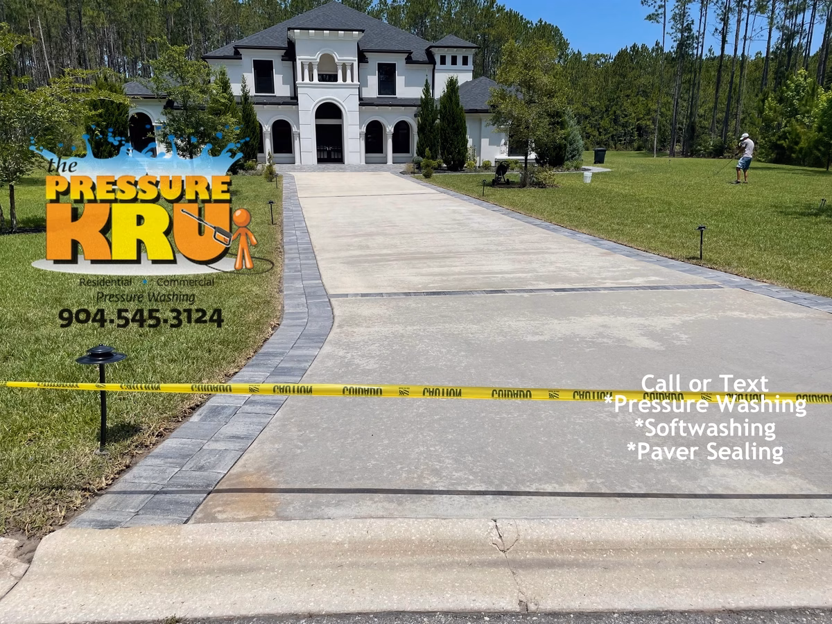 Driveway cleaning in Greenbriar Plantation luxury home after professional washing.