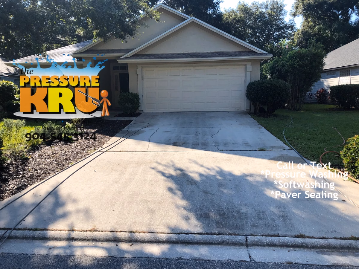 Driveway pressure washing in St. Augustine, FL. before removing mold and algae.