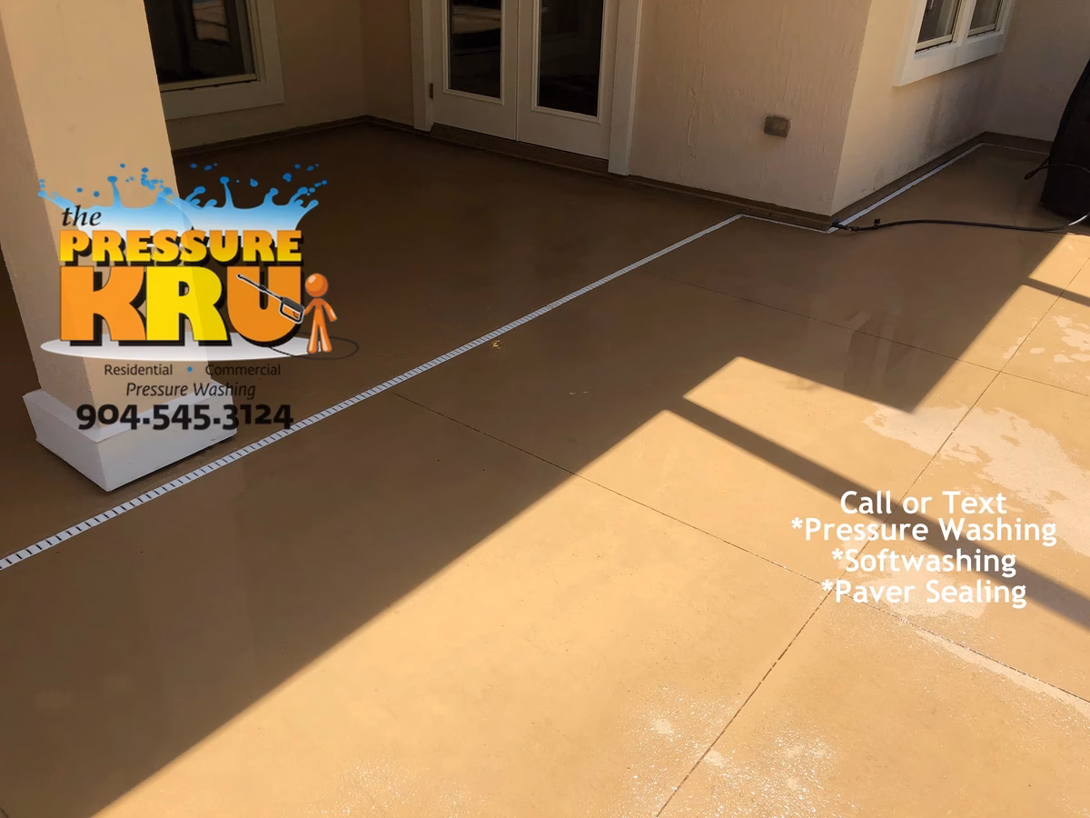 Pressure cleaning painted concrete around pool in Fruit Cove, FL after