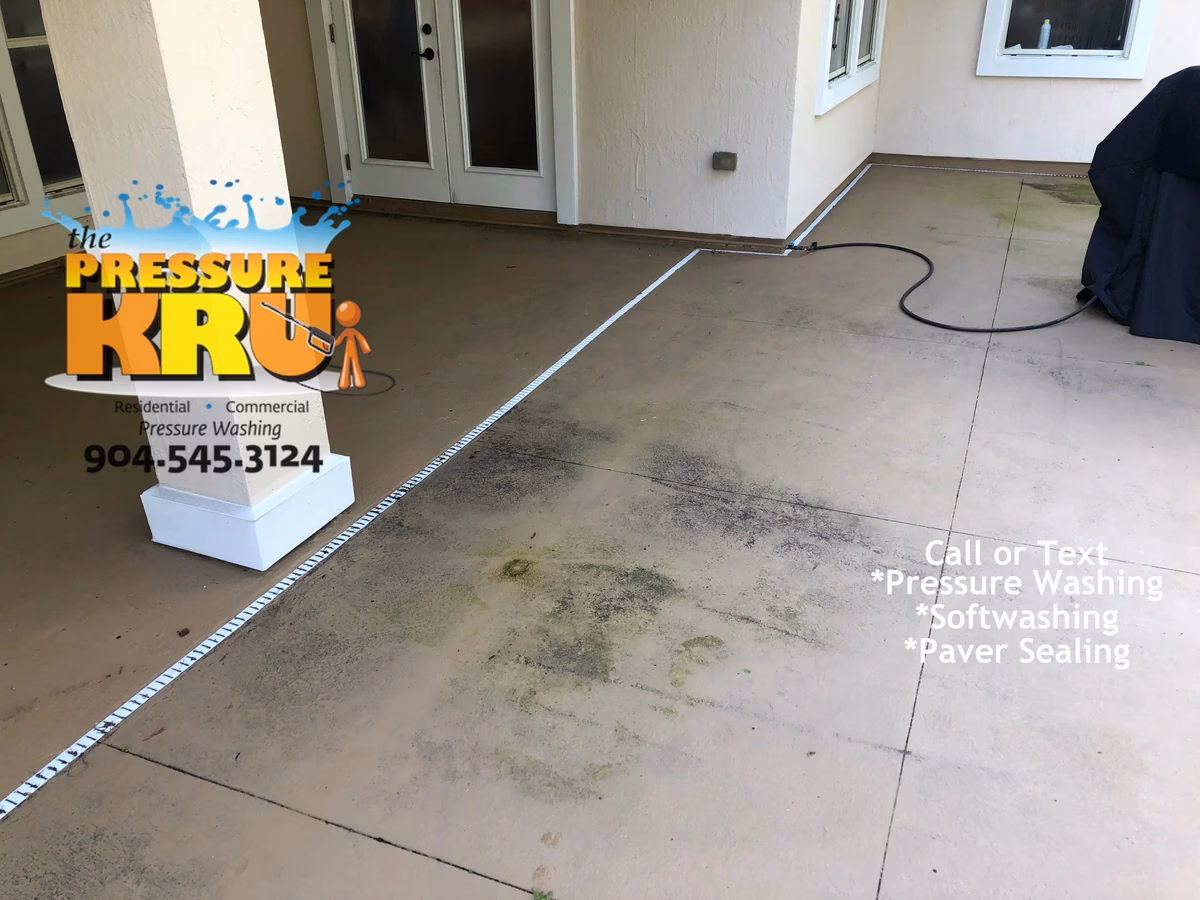 Pressure cleaning painted concrete around pool in Fruit Cove, FL before