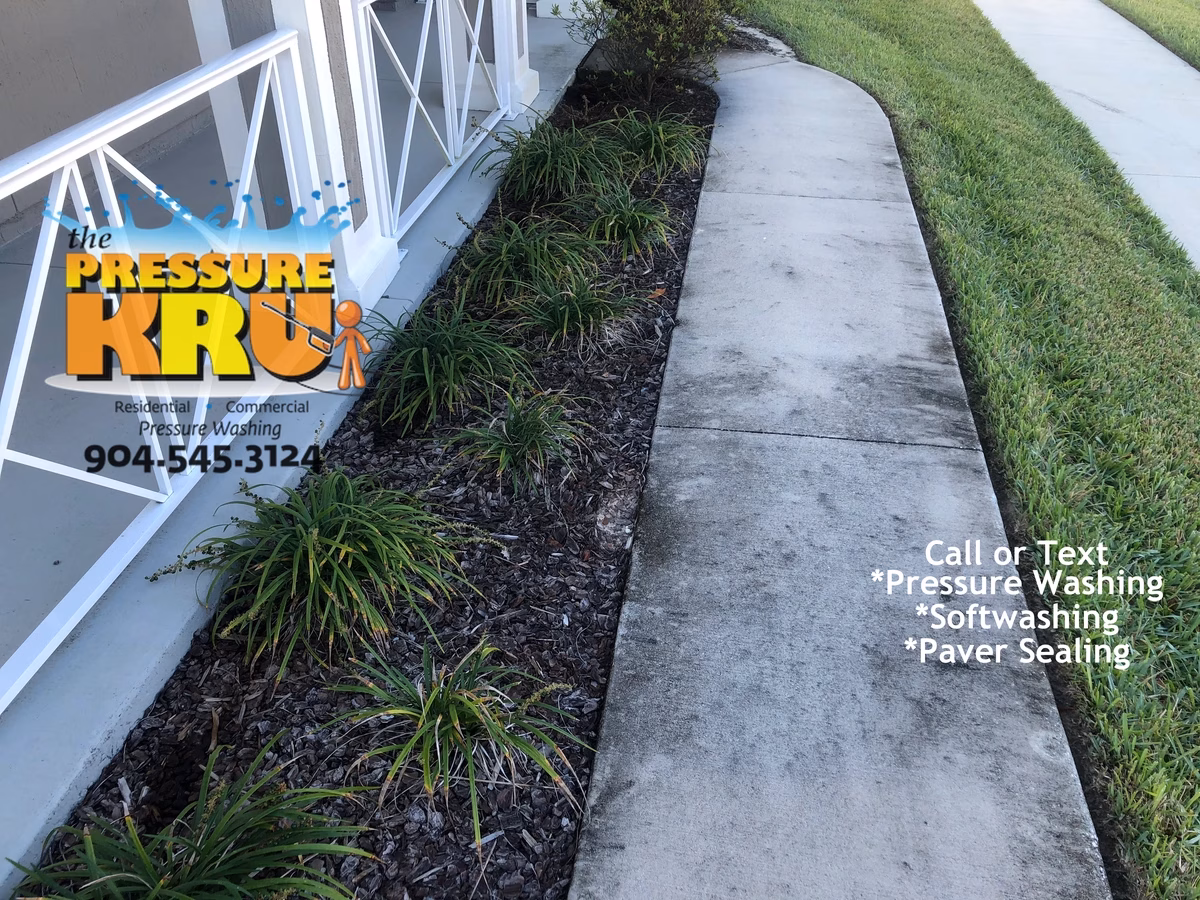 Sidewalk pressure cleaning in Fruit Cove, FL before softwashing.