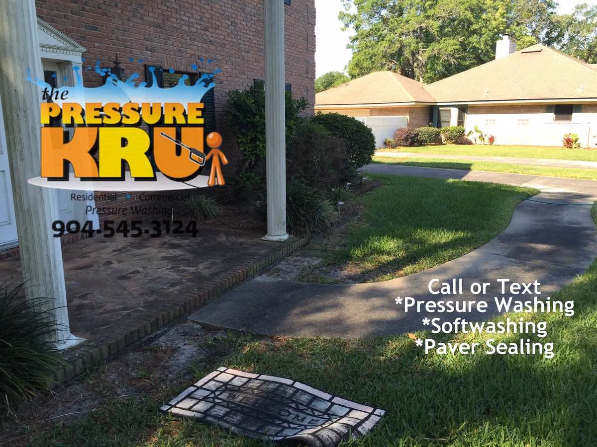 Driveway pressure washing service in St. Johns, FL before chemical treatment.