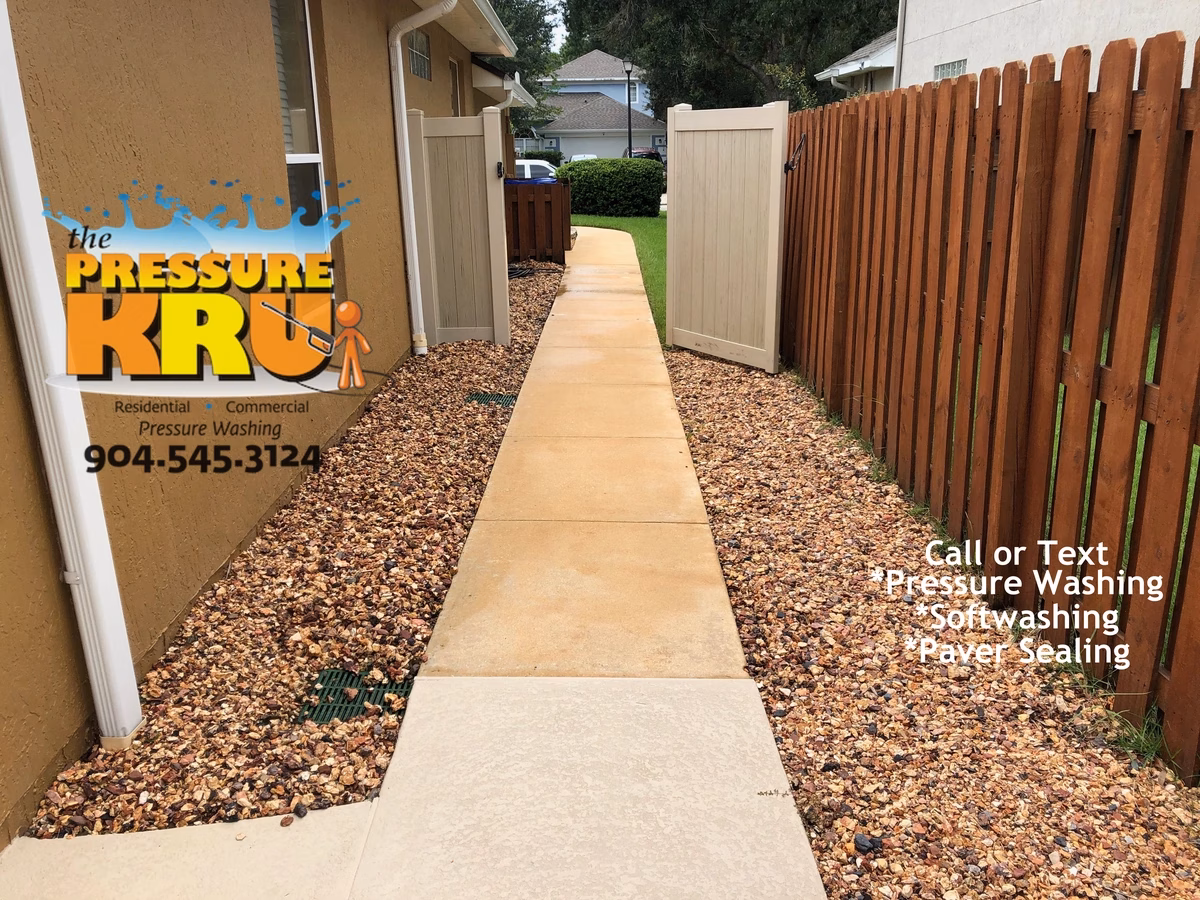 Driveway and sidewalk pressure washing service in St. Johns, FL after chemical treatment. What a difference chemicals make.