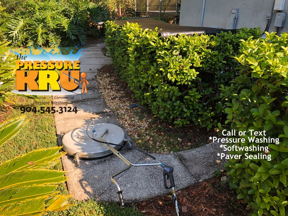 Concrete patio pressure washing in St. Augustine, FL before chemical treatment.