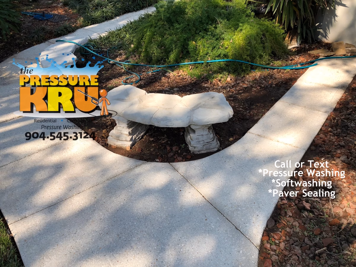 Sidewalk pressure washing in St. Augustine, FL before cleaning. Notice grime removed from deep pores.