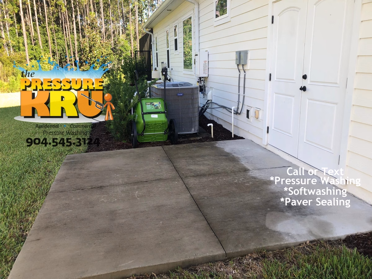 Concrete patio cleaning in St Johns FL before house wash and softwash.