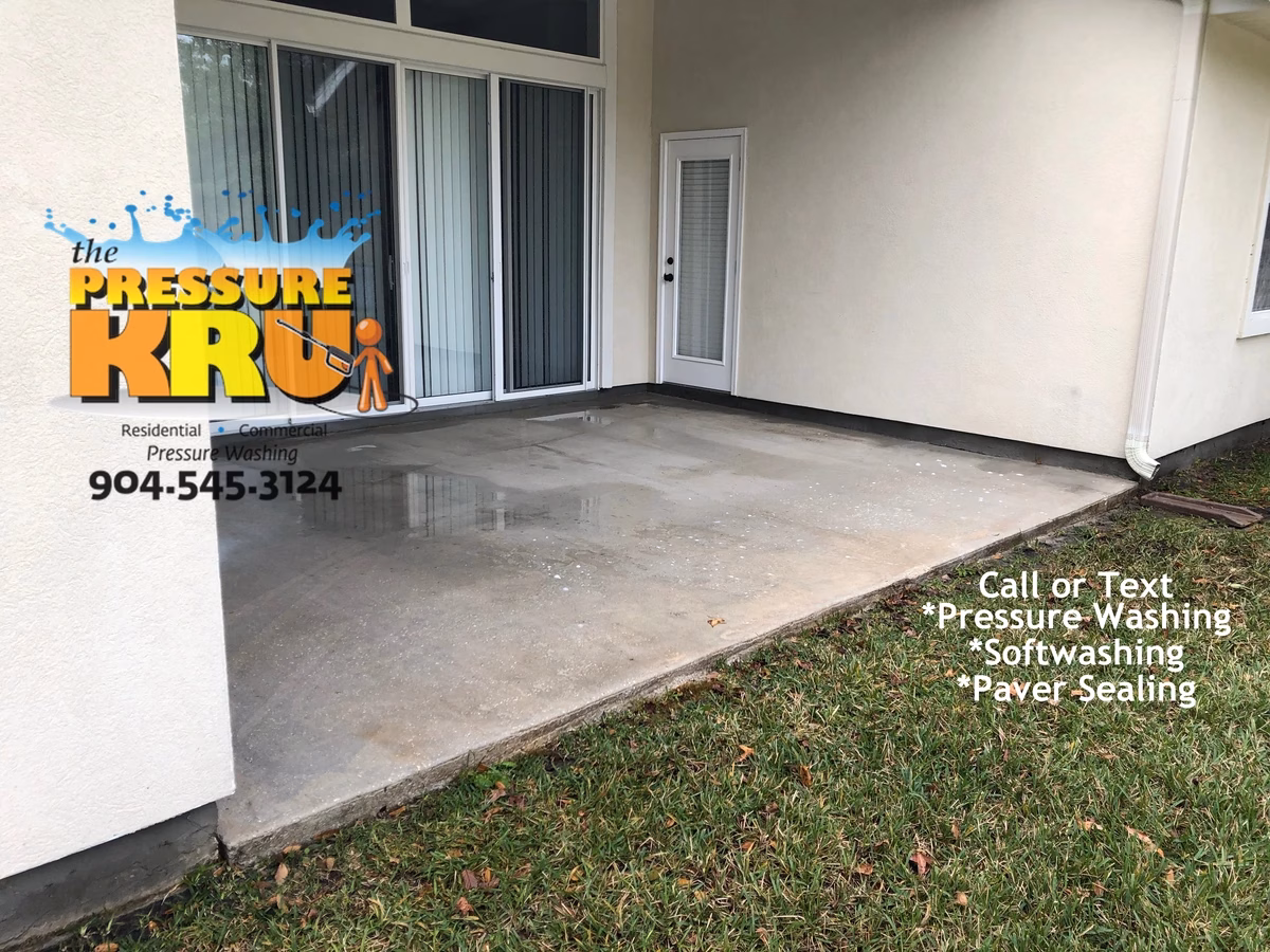 Concrete patio pressure washing in Jacksonville Florida after professional cleaning.