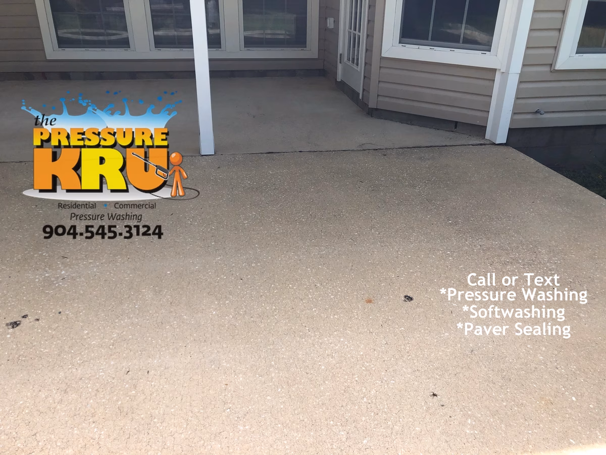 Concrete patio pressure washing in St Augustine FL after cleaning.