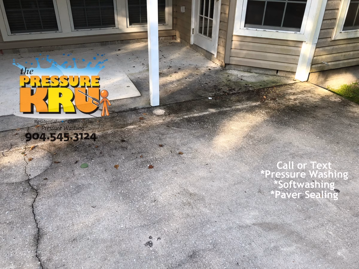 Concrete patio pressure washing in St Augustine FL before cleaning.