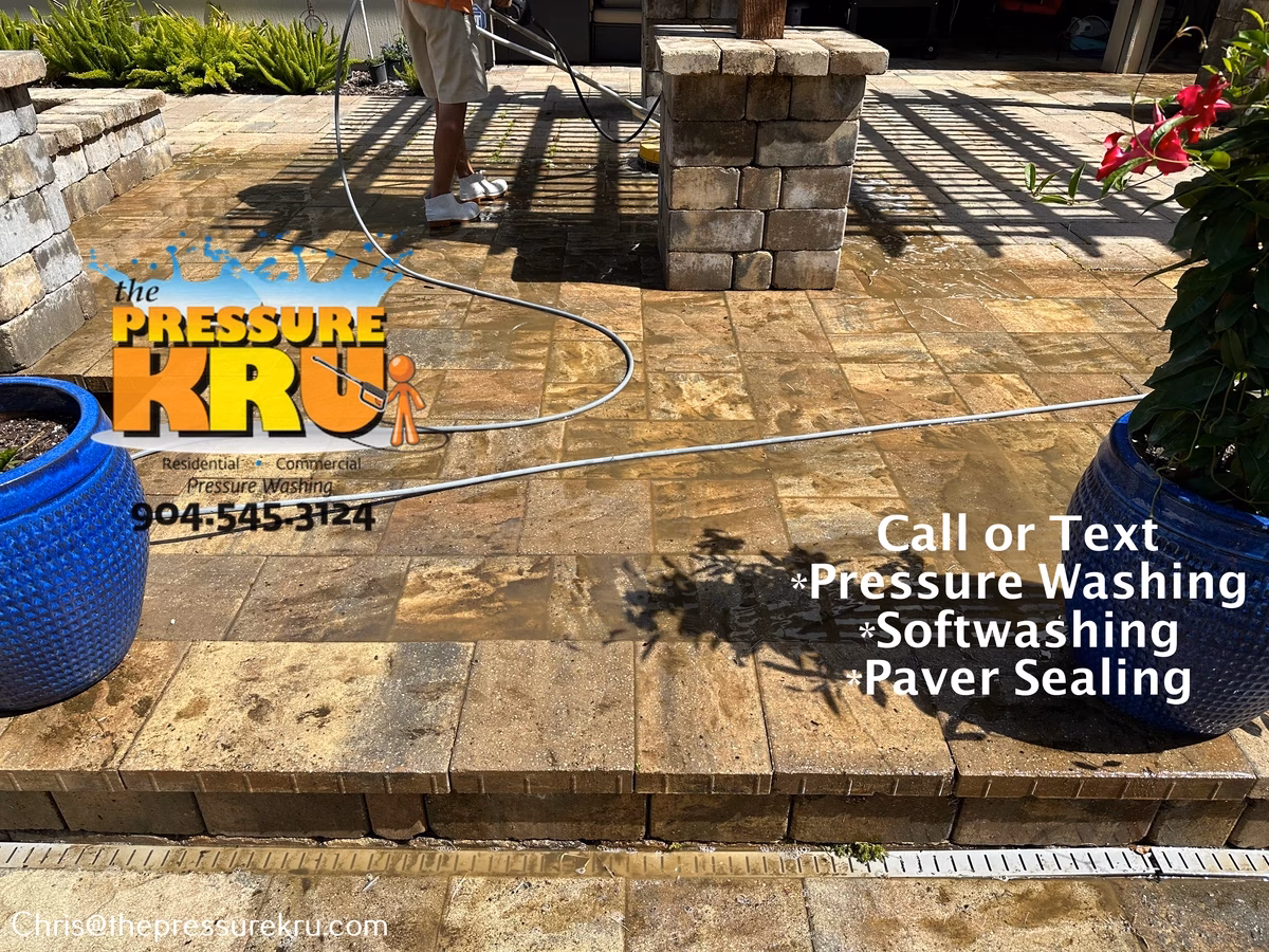 Pool deck cleaning service for concrete pavers in St. Johns, FL before.
