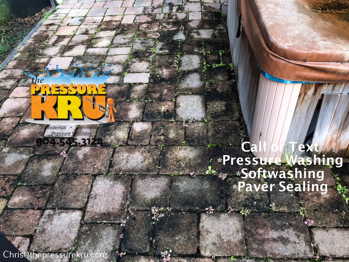 Stained paver patio in Shearwater before professional pressure washing