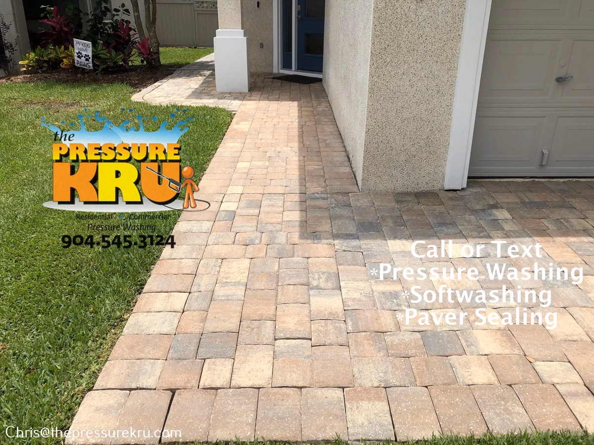 Beautiful clean paver driveway after pressure washing in Durbin Crossing.