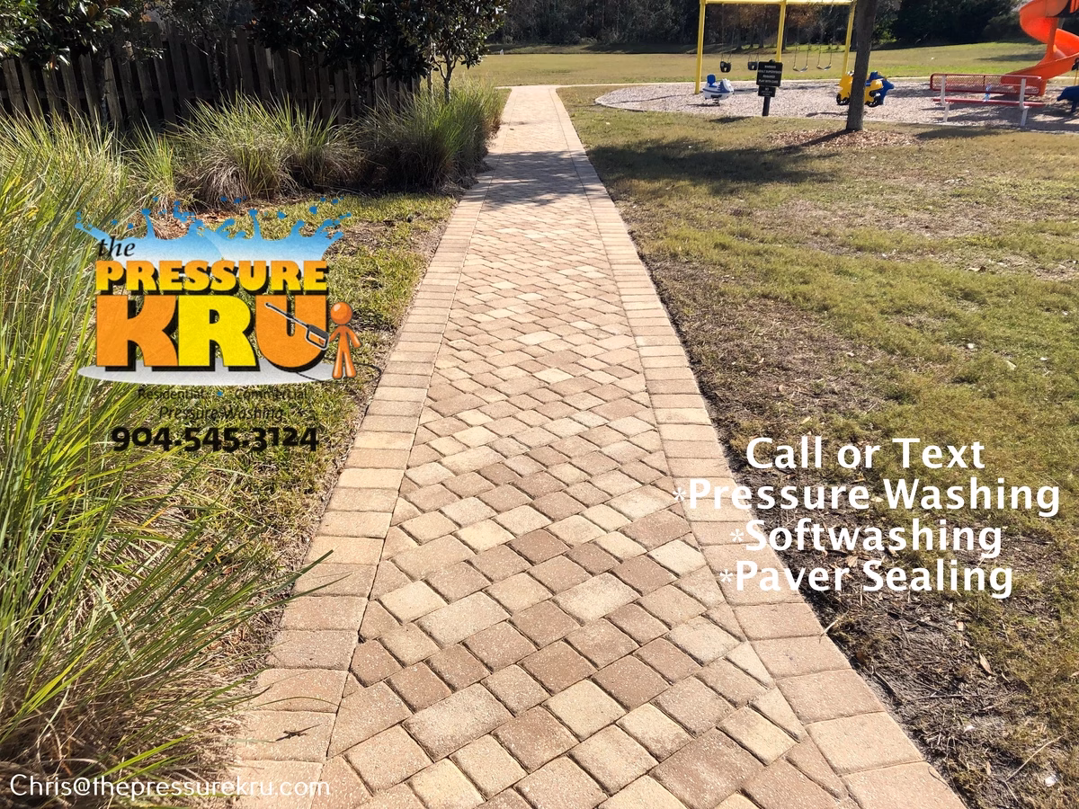 Weathered paver sidewalk after professional cleaning in Silverleaf Village.