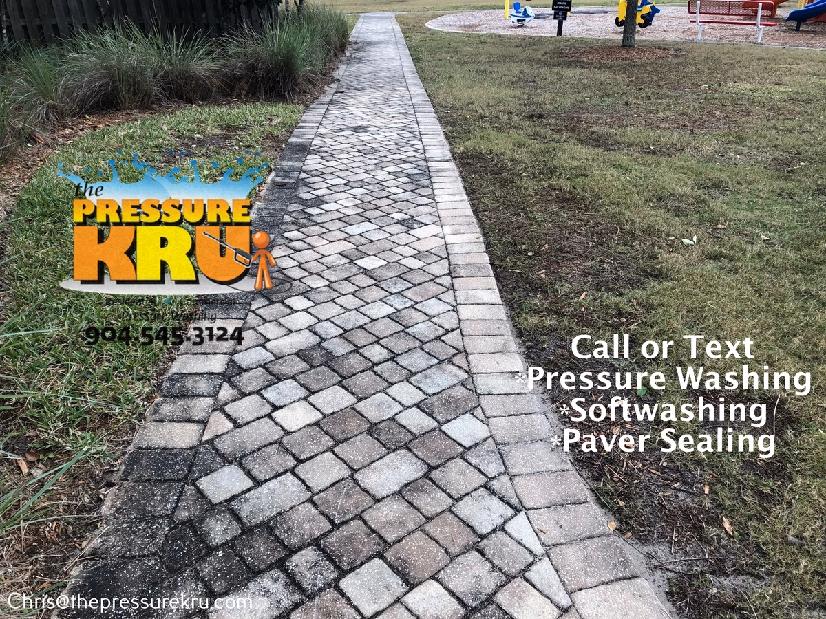 Weathered paver sidewalk before professional cleaning in Silverleaf Village.