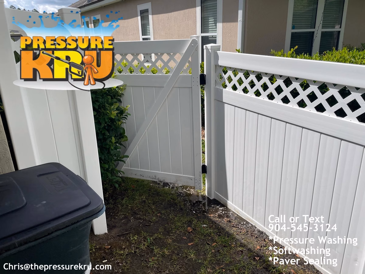 Residential vinyl fence cleaning in Oxford Estates after green mold removal